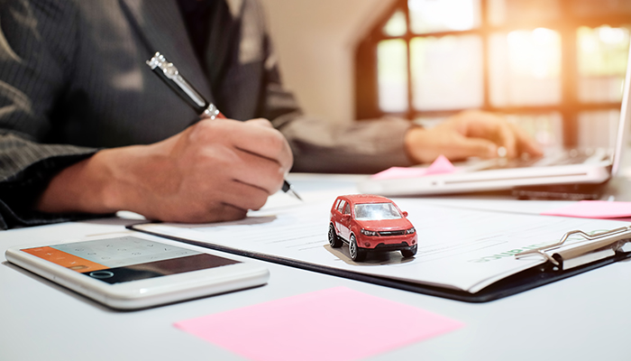 Paperwork and toy car Paperwork and toy car